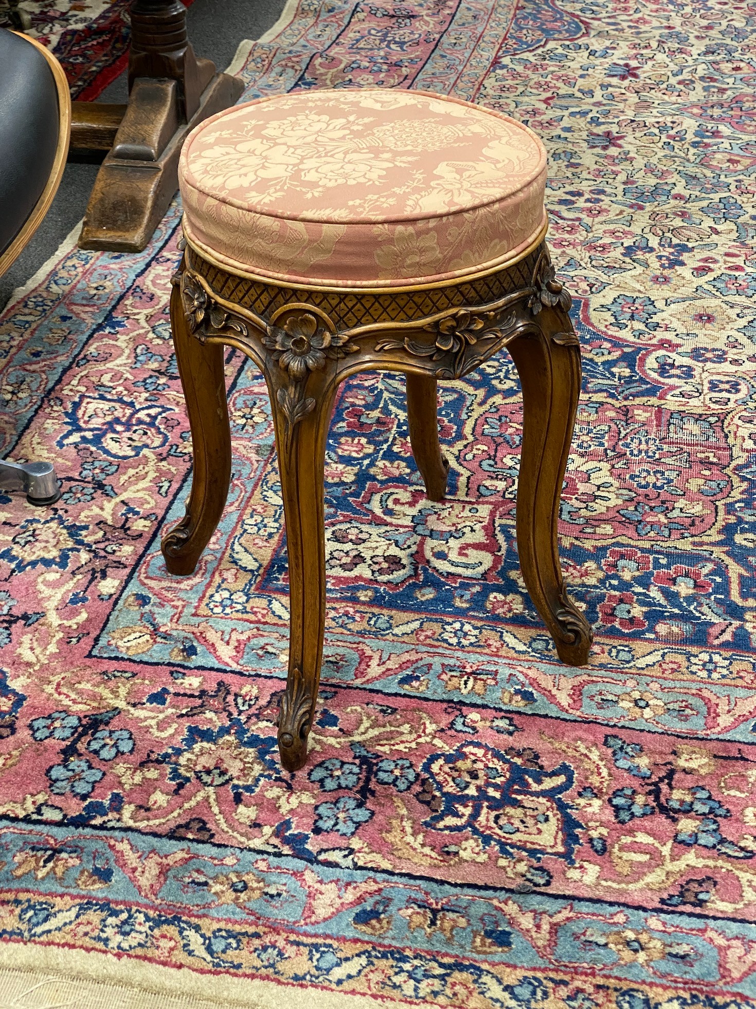 An early 20th century French carved walnut dressing stool